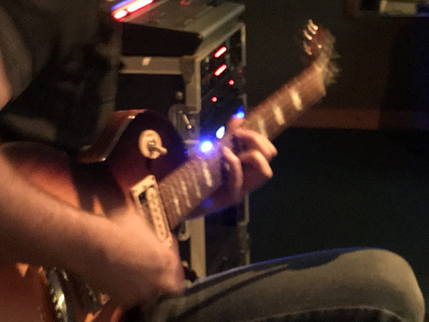 Guitarist soundchecking guitar for a recording session at Choice Blend Studio Miami.