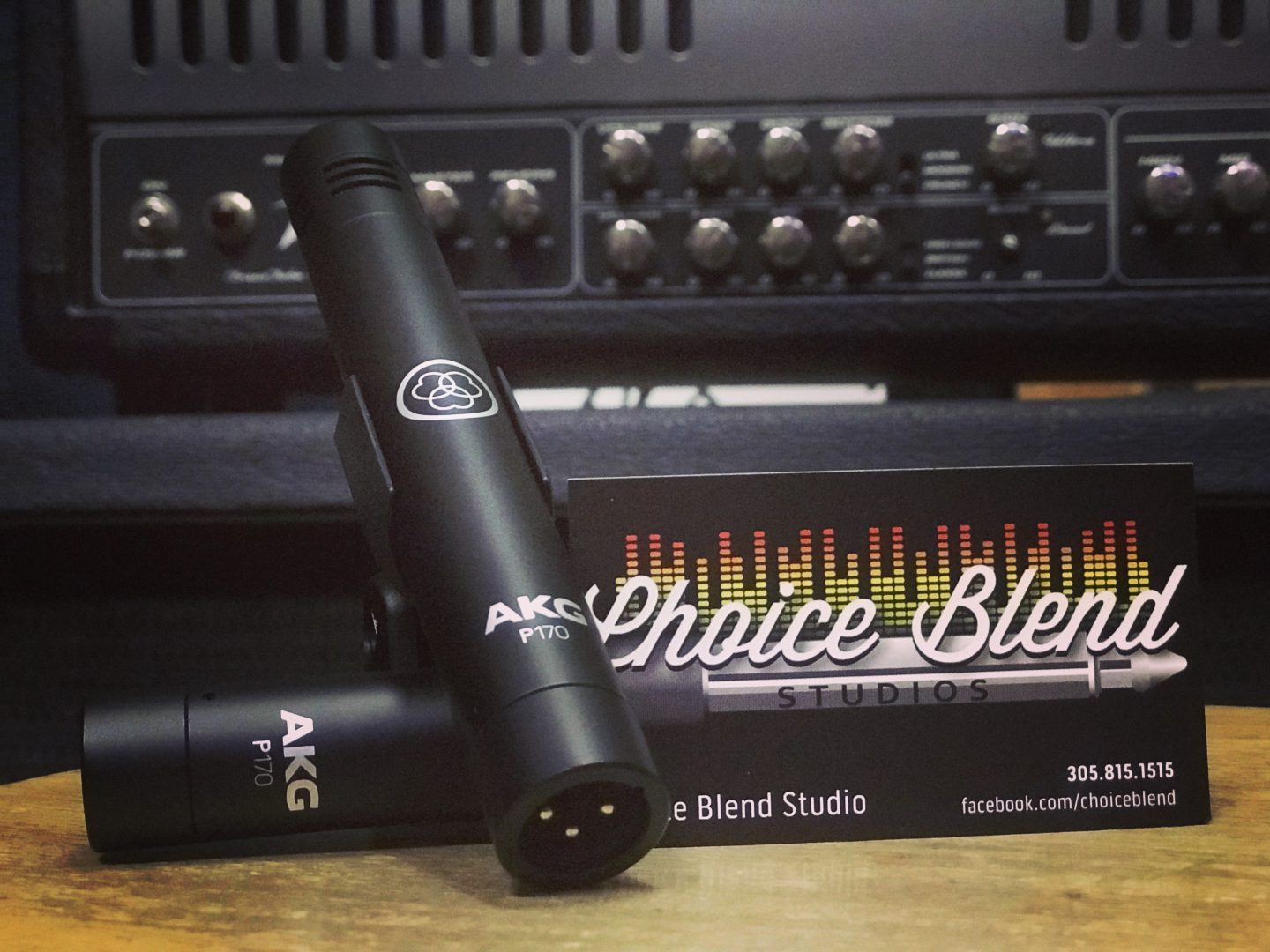Microphones used for a recording session at Choice Blend Studio with a business card for Choice Blend Studio.