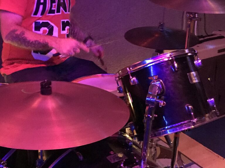Image of a person playing drums.