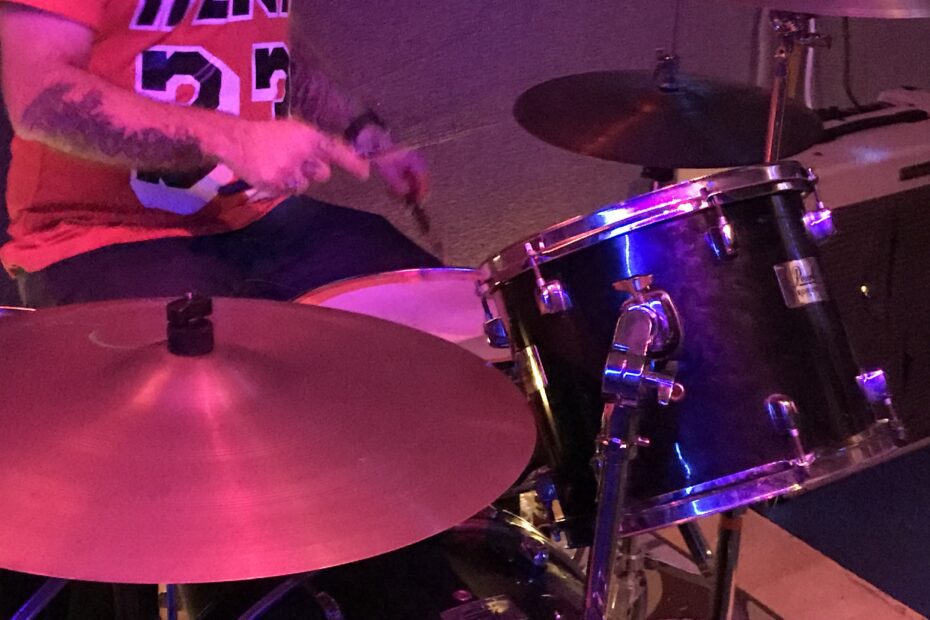 Image of a person playing drums.